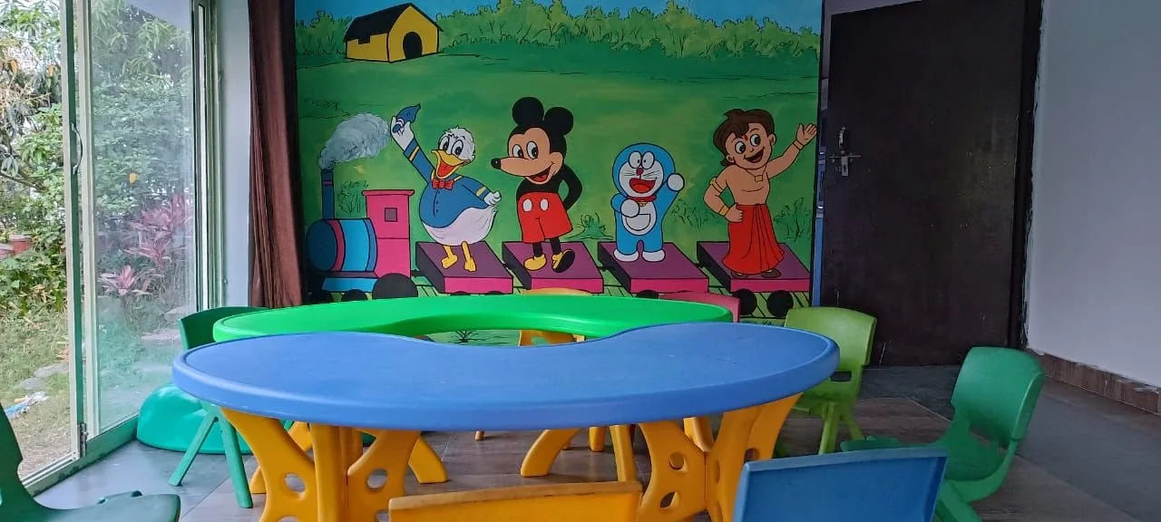 Colourful child-sized tables in the Paathshala classroom